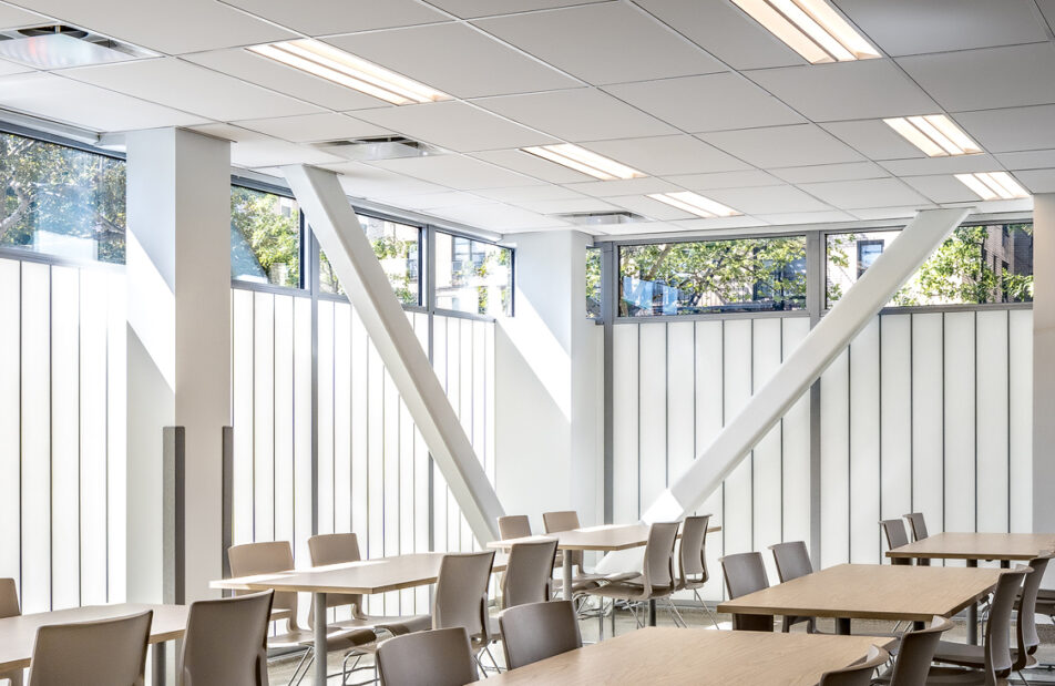 Modern multi-story building called Argus Community featuring large windows highlighting innovative architectural design and energy-efficient translucent glazing solutions by Kalwall.