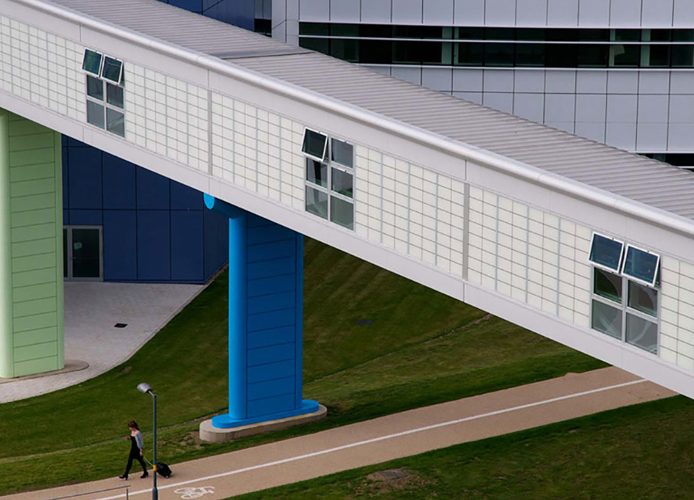 Linkbridge at Queen Elizabeth Hospital in Birmingham, UK, featuring Kalwall panels on canopy, with green and blue accents