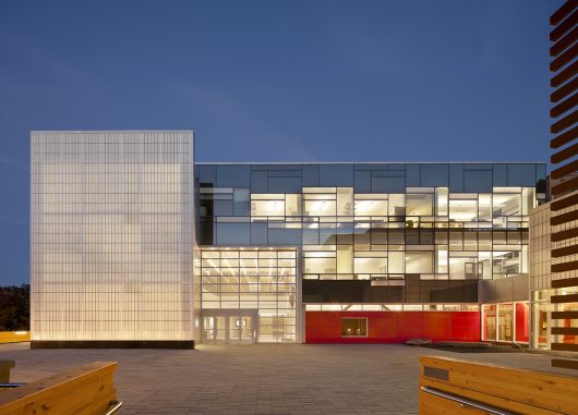 Cornell School of Ecology at nighttime with glass walls and Kalwall wall panel systems on two exterior walls