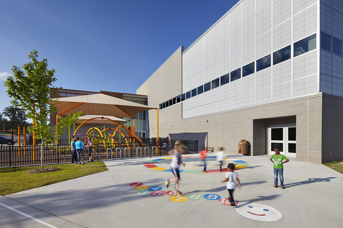 Abbotts Creek Community Center exterior with children playing in front of building clad with Kalwall FRP panel wall system
