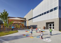 Abbotts Creek Community Center exterior with children playing in front of building clad with Kalwall FRP panel wall system