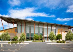 Faith Chapel with multiple sections of Kalwall translucent sandwich panels on building with sloped roof in front of blue sky