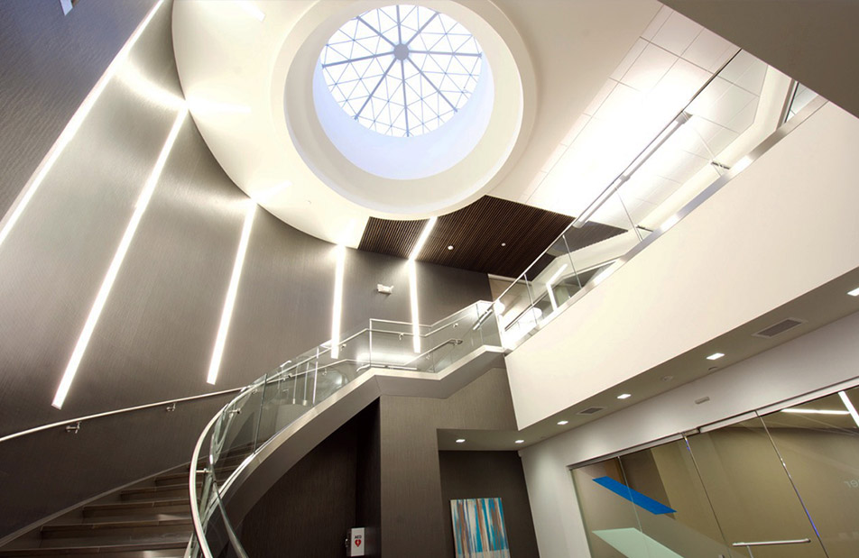 Kalwall geo-roof application in dark-walled building above a spiral staircase