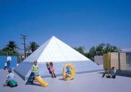 Exterior view of Kalwall skylight at La Marina Preschool surrounded by children playing on various toys