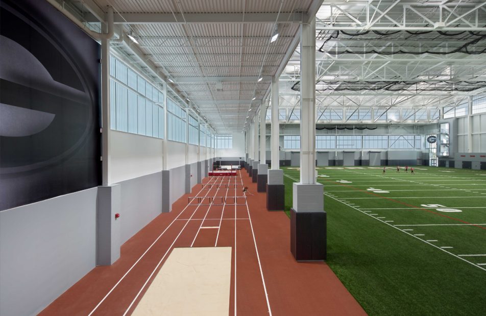 University of Georgia's indoor athletic facility featuring astroturf and running track surrounded by a Kalwall wall system