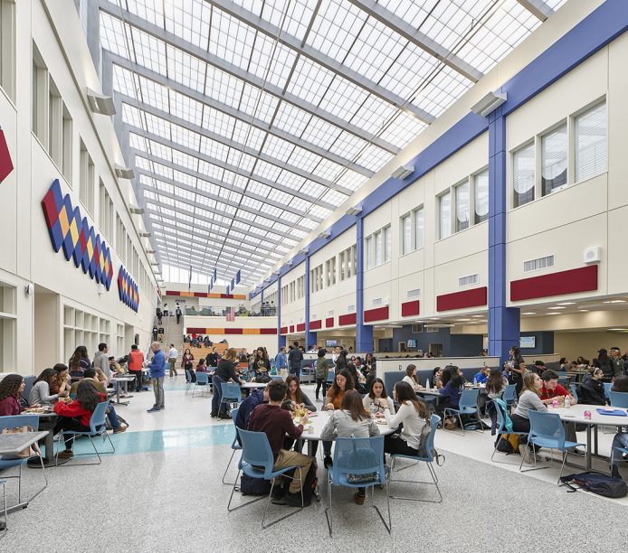 Hudson County Tech High School in Secaucus, New Jersey, featuring students sitting in atrium under Kalwall skyroof®