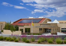 Amy Biehl School exterior in Santa Fe, New Mexico features solar panels as well as numerous custom skylights.