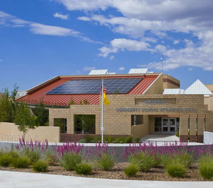 Amy Biehl School exterior in Santa Fe, New Mexico features solar panels as well as numerous custom skylights.