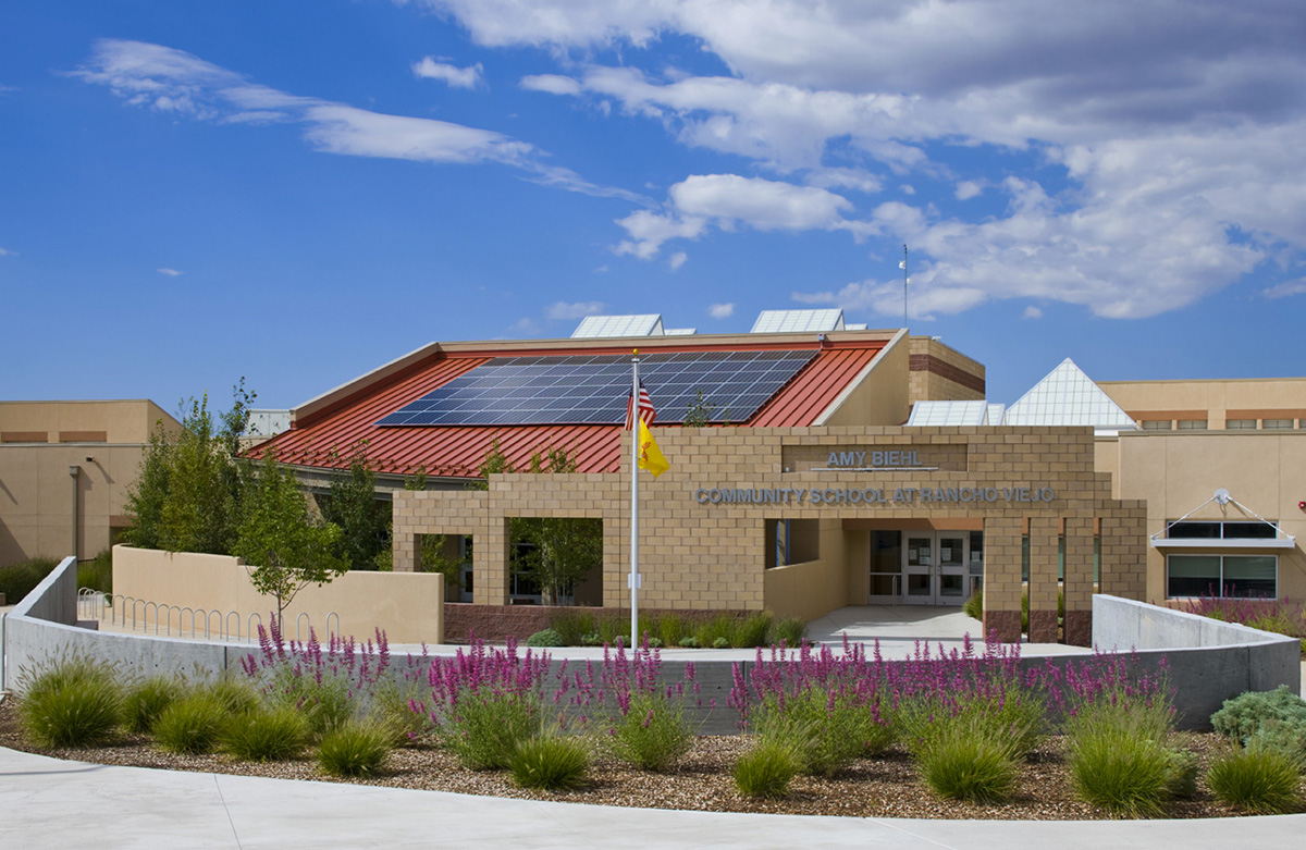 Amy Biehl School exterior in Santa Fe, New Mexico features solar panels as well as numerous Kalwall skylights