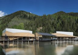 Aspen Music School in front of mountains, blue sky, and lake, featuring Kalwall translucent facade panel wall