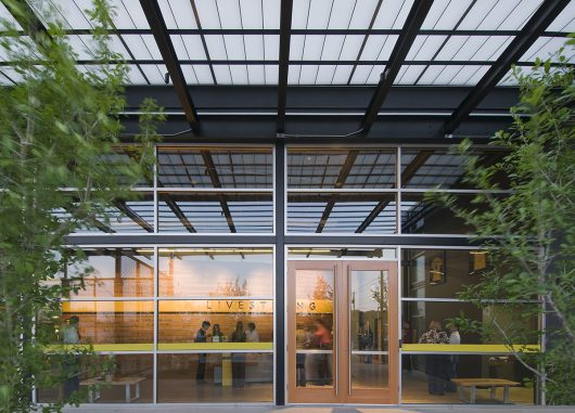 Livestrong Foundation building from outside with Livestrong sign visible through window and Kalwall canopy system overhead