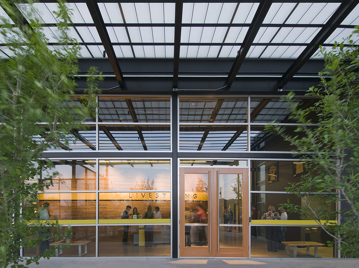 Livestrong Foundation building from outside with Livestrong sign visible through window and Kalwall canopy system overhead