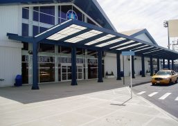 Brooklyn Cruise Terminal building exterior featuring white metal paneling on building and Kalwall translucent canopy system