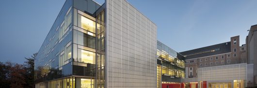 Cornell School of Ecology at nighttime with glass walls and Kalwall wall panel systems on two exterior walls