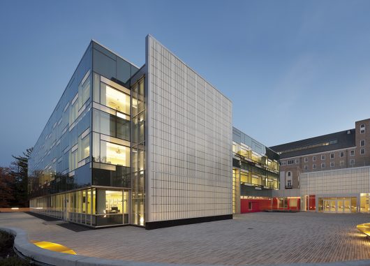 Cornell School of Ecology at nighttime with glass walls and Kalwall wall panel systems on two exterior walls