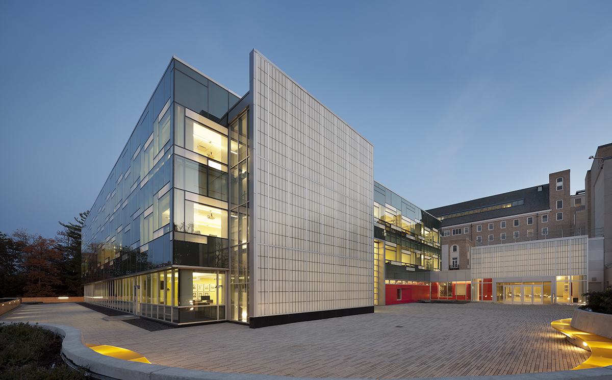 Cornell School of Ecology at nighttime with glass walls and Kalwall wall panel systems on two exterior walls