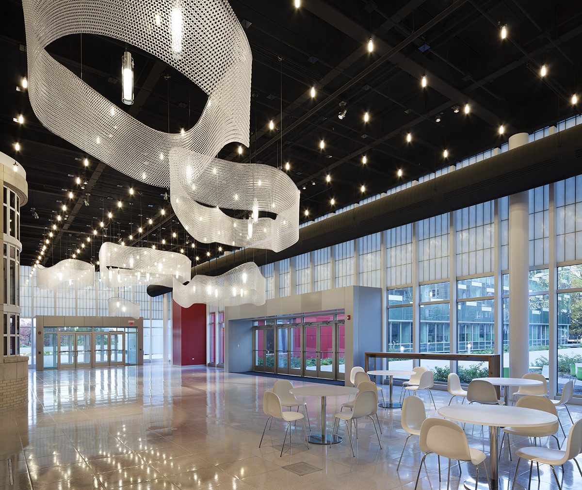 Cornell School of Ecology at nighttime with glass walls and Kalwall wall panel systems on two exterior walls