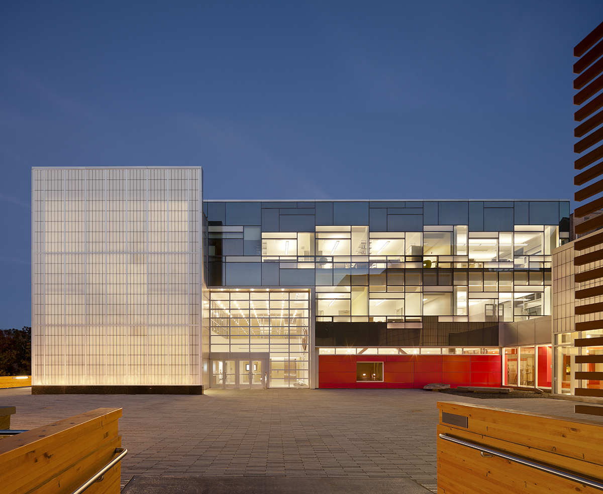Cornell School of Ecology at nighttime with glass walls and Kalwall wall panel systems on two exterior walls