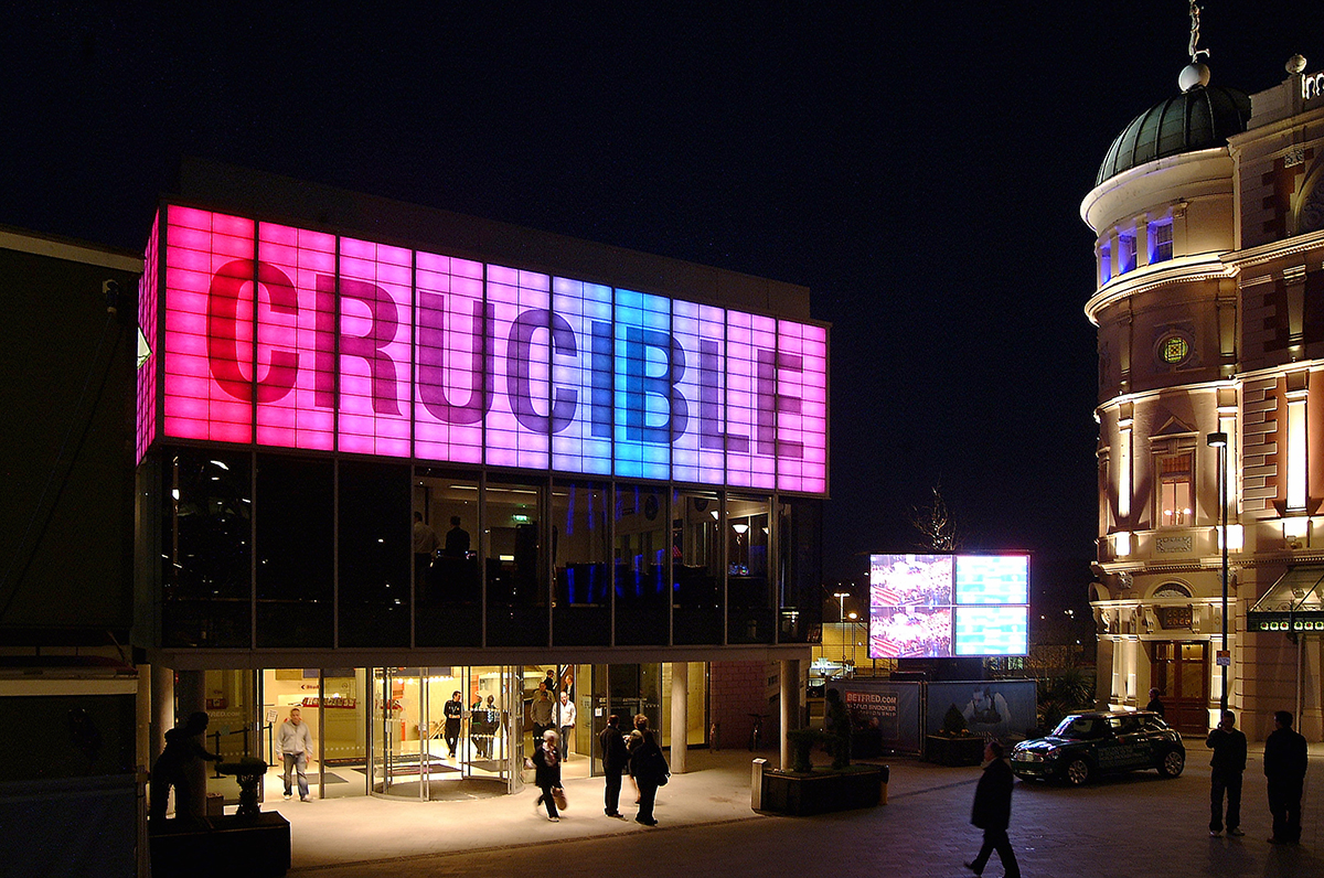 Crucible Theater building exterior with glass walls and sign with large lettering on Kalwall facade featuring backlighting