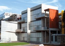 Building exterior featuring Kalwall curtain wall system of translucent panels with four balconies and one center column