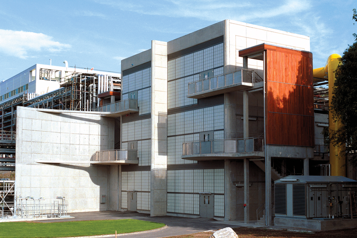 Building exterior featuring Kalwall curtain wall system of translucent panels with four balconies and one center column