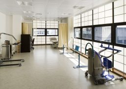 Interior of a medical center in Dublin, featuring Kalwall's translucent panels providing natural light, with medical equipment and treatment areas visible.