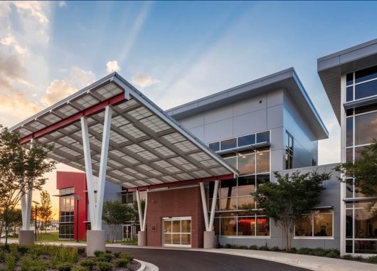 West Tennessee Transitional Care Facility exterior featuring a Kalwall canopy at sunset