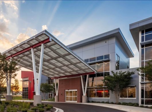 West Tennessee Transitional Care Facility exterior featuring a Kalwall canopy at sunset