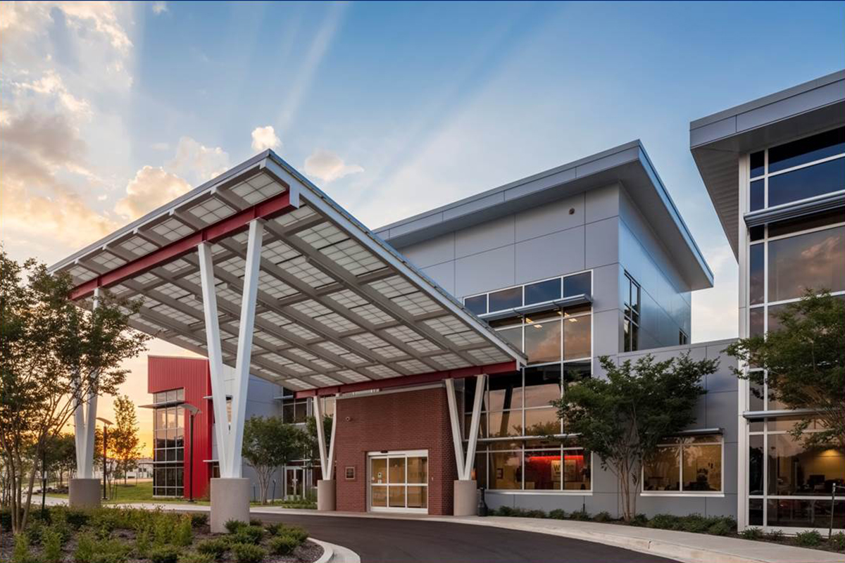 West Tennessee Transitional Care Facility exterior featuring a Kalwall canopy at sunset