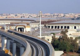 Busy city of Dubai featuring many buildings and roads with one building featuring Kalwall translucent panels in upper portion