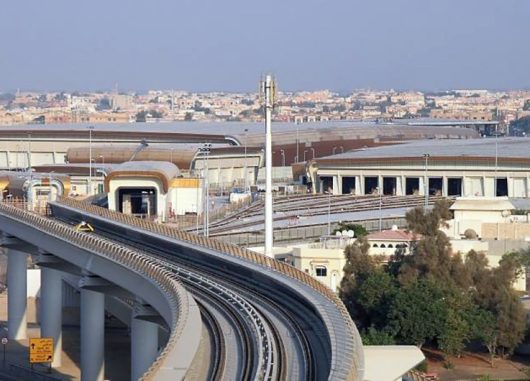 Busy city of Dubai featuring many buildings and roads with one building featuring Kalwall translucent panels in upper portion