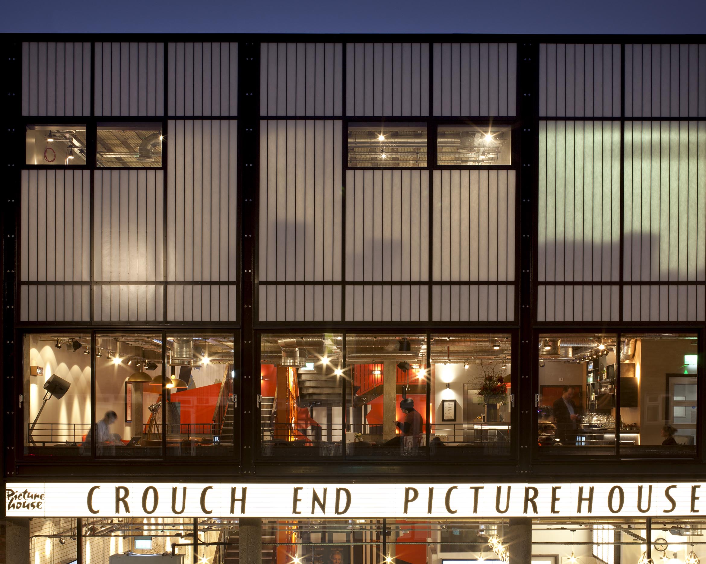Kalwall facade on Crouch End Picturehouse in London, United Kingdom, lit up at nighttime