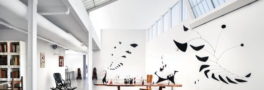 Calder Foundation interior featuring Kalwall skyroof&reg; and Kalwall wall panel sections above metal art