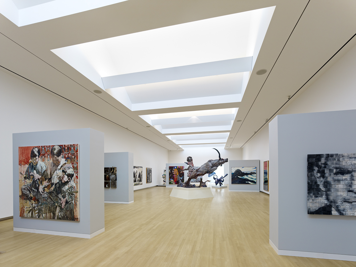 Crocker Art Museum interior with wood floors and artwork below hidden Kalwall skylight system