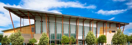 Faith Chapel with multiple sections of Kalwall translucent sandwich panels on building with sloped roof in front of blue sky