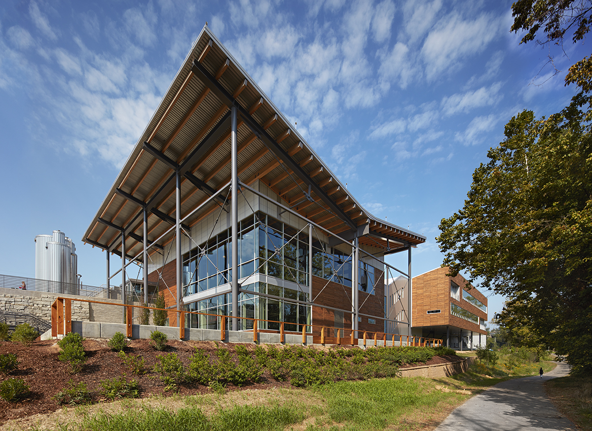 Exterior of New Belgium Brewery building with sloped roof featuring aluminum beams and Kalwall facade of wall panels
