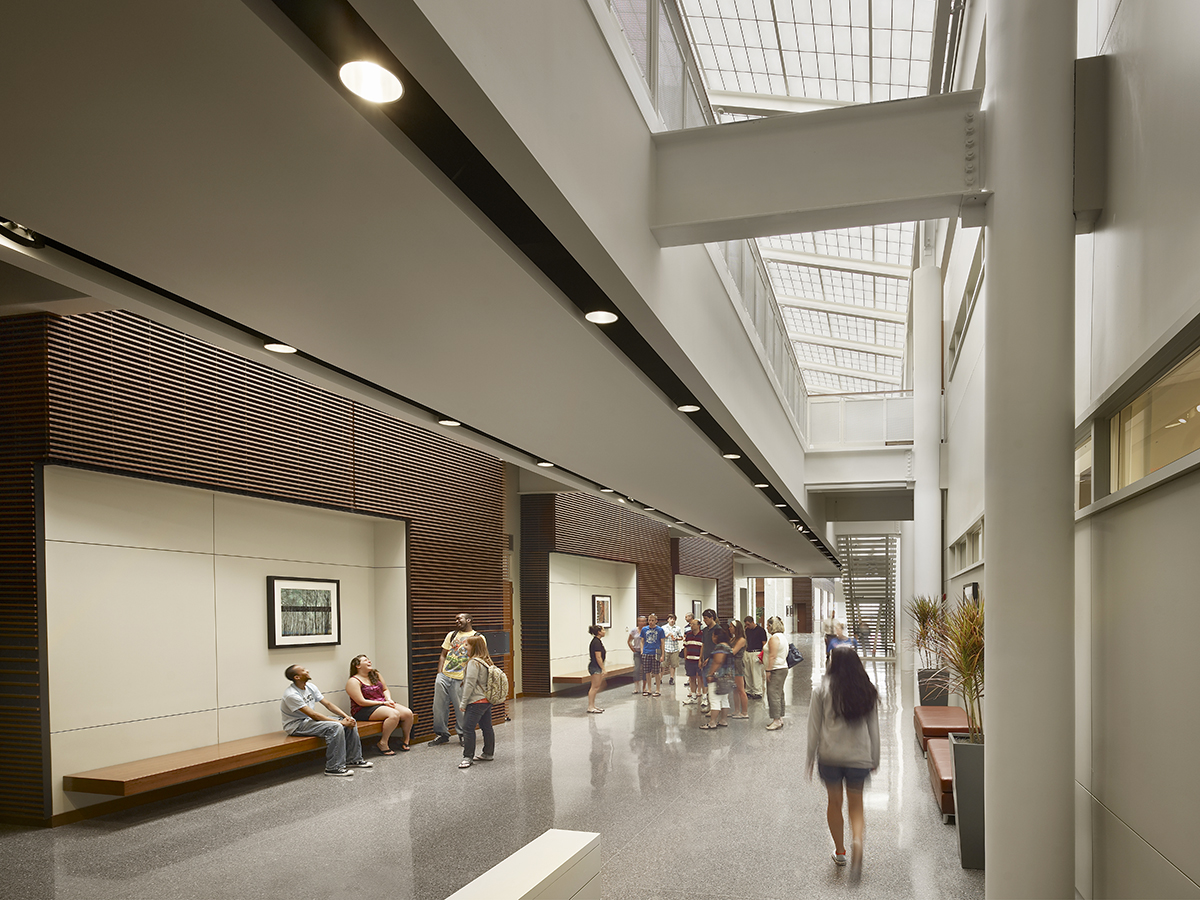 Stockton Campus Center interior featuring students walking below Kalwall translucent roof panels in skylight application