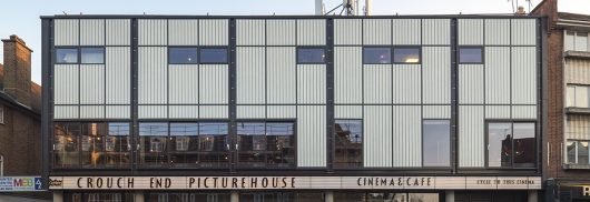 Crouch End Picturehouse exterior at dusk featuring Kalwall transluent facades with unitized curtain wall