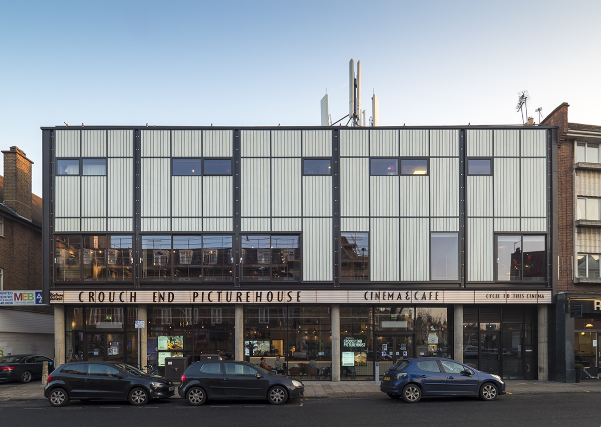 Crouch End Picturehouse exterior at dusk featuring Kalwall transluent facades with unitized curtain wall