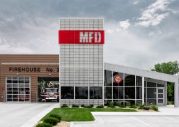 Manhattan Fire Department exterior with Kalwall wall system grid of FRP panels and red overlay with MFD cutout letters