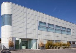 Sports Club exterior in Madrid, Spain, featuring translucent daylighting facade with Kalwallwall panels and unitized windows