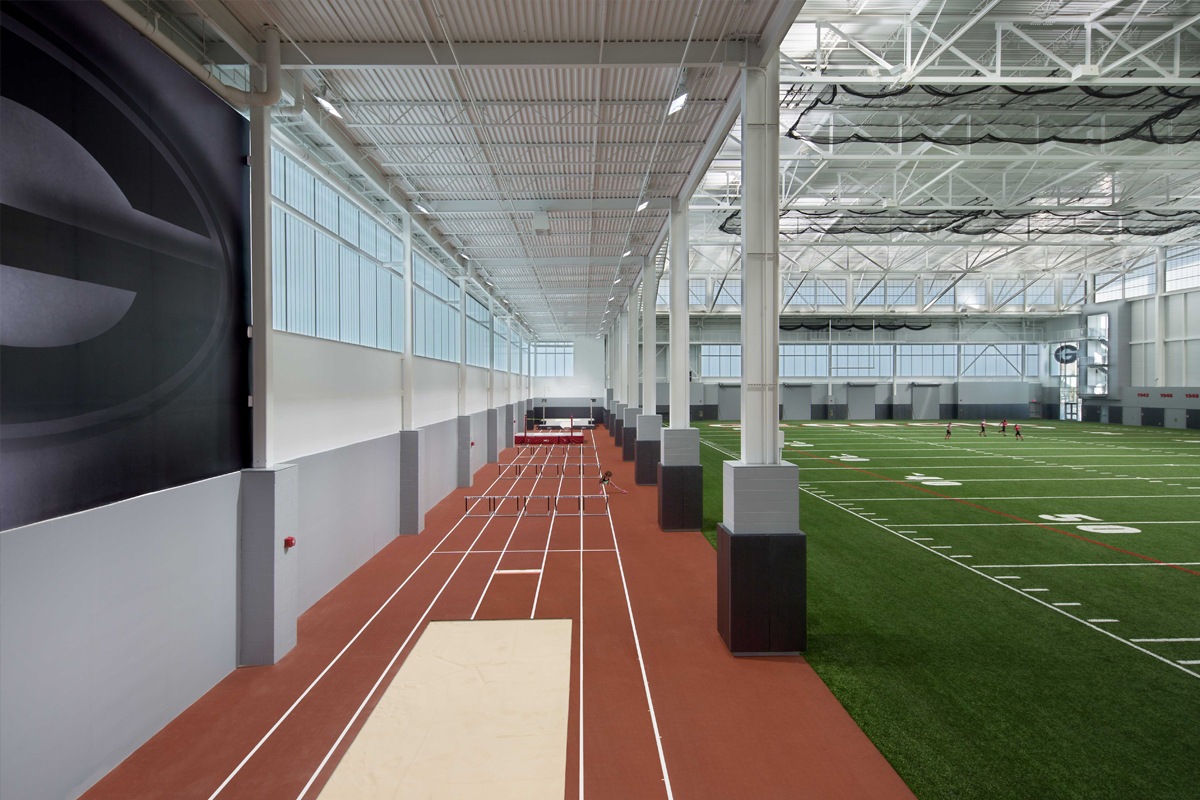 University of Georgia's indoor athletic facility featuring astroturf and running track surrounded by a Kalwall wall system