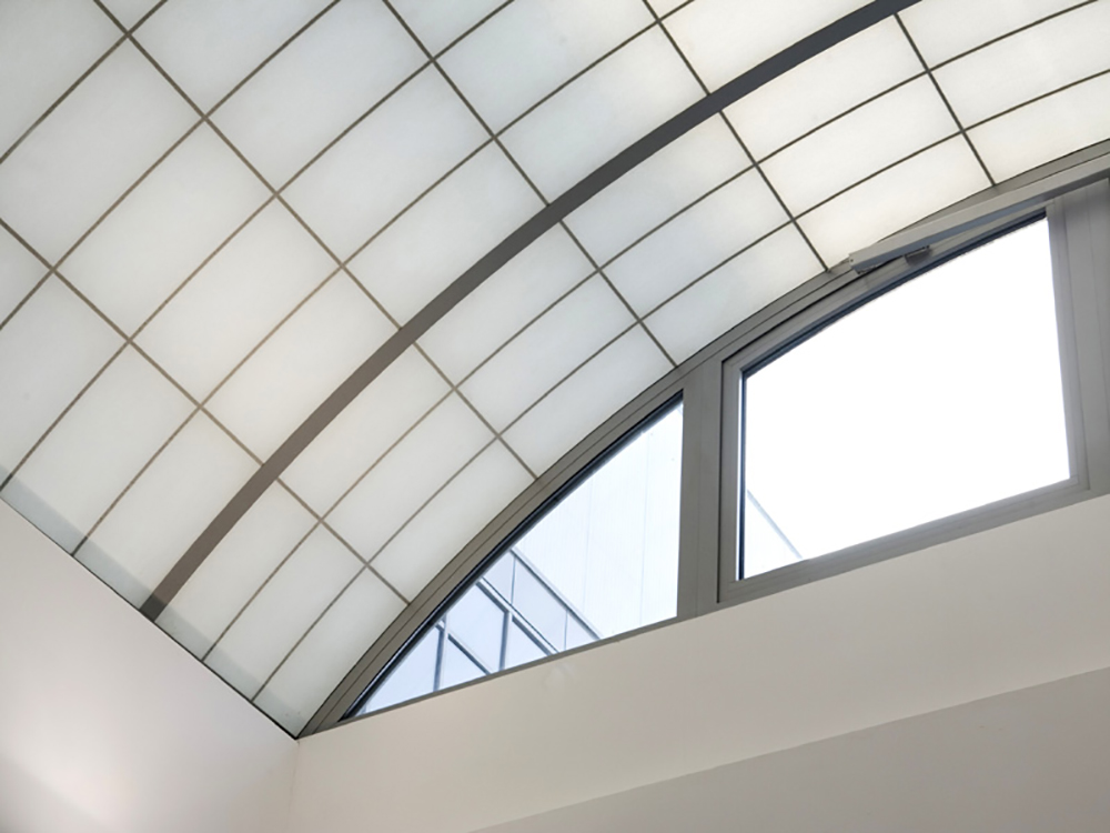 Close-up of Kalwall custom skyroof® with white wall and glass windows