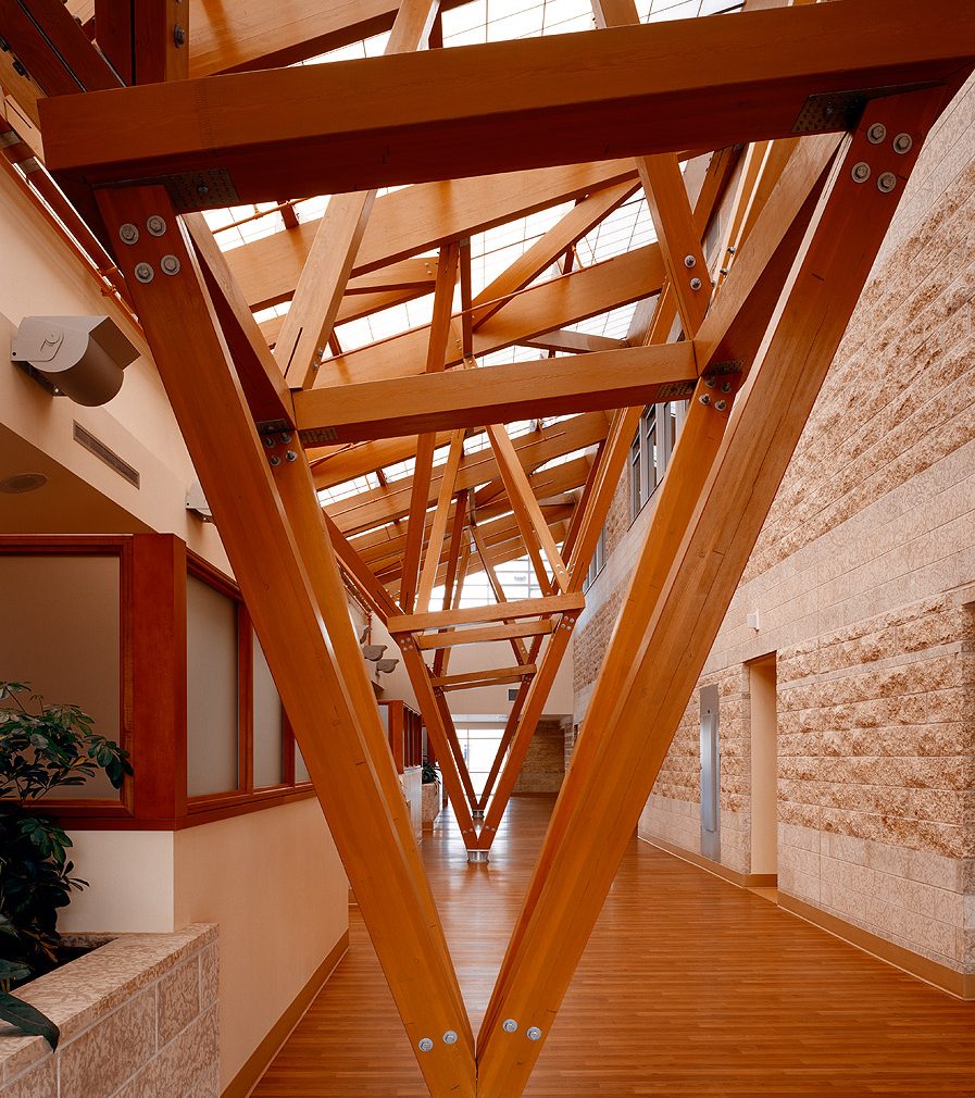 Building interior featuring intricate wood plank detailing with Kalwall skyroof® system overhead