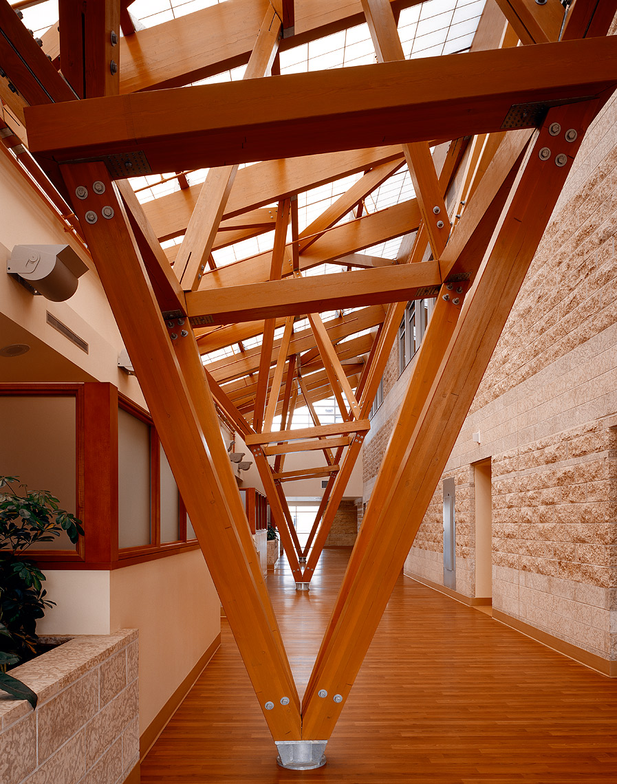 Building interior featuring intricate wood plank detailing with Kalwall skyroof&reg; system overhead