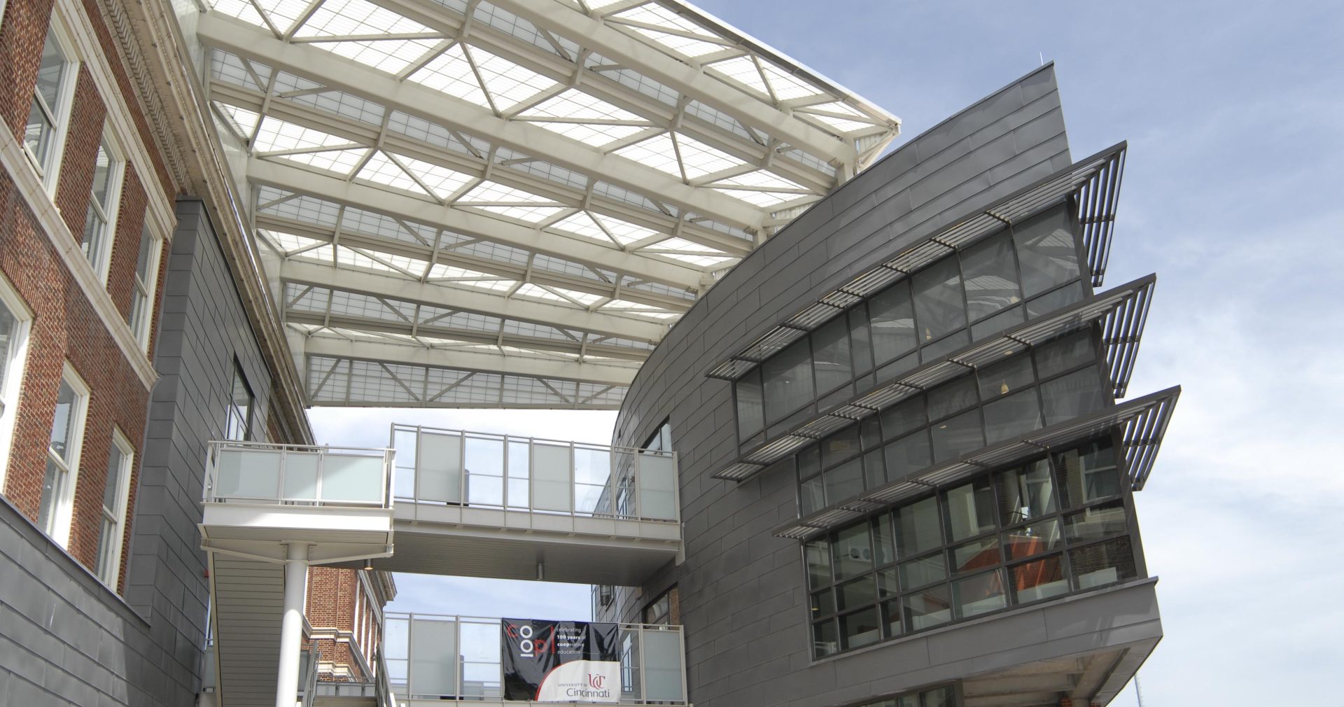 University of Cincinnati Student Life Center featuring two buildings attached by walkway with Kalwall canopy above