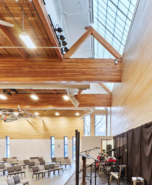 Interior featuring Kalwall skylight set amongst wooden paneling at the James North Baptist Church.