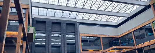 Butler interior featuring Kalwall skyroof&reg; amongst metal and wooden detailing.