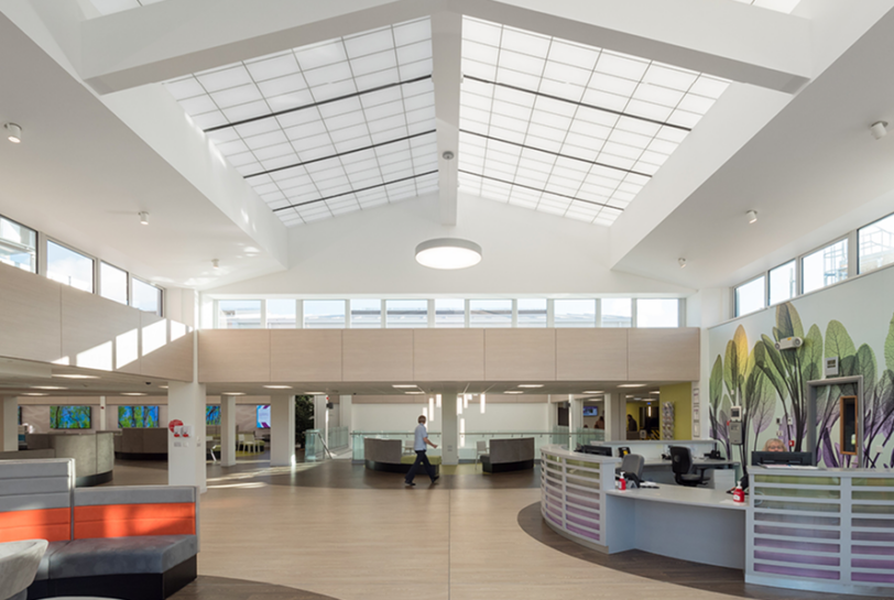 Benenden Hospital atrium and lounge area featuring skylights with Kalwall translucent sandwich panels and fiberglass reinforced panels